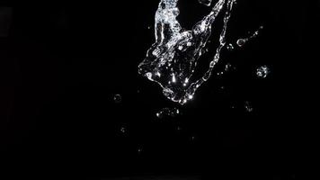 Water splash shot in studio, white water and black background, pure water for drink and food concept copy space for text and desig photo