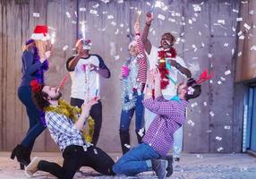 multiethnic group of casual business people having confetti party photo