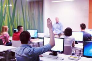 student answering a question in classroom photo