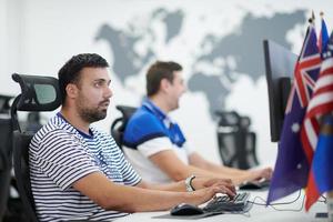 two male software developers working on computer photo
