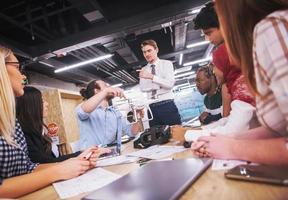 multiethnic business team learning about drone technology photo