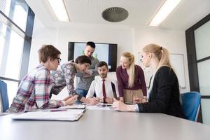 young business people group on meeting at modern office photo