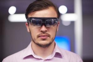 man using virtual reality gadget computer glasses photo