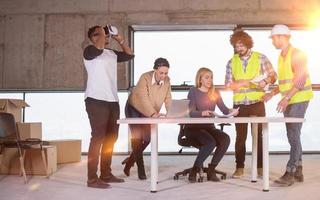 group of multiethnic business people on construction site photo