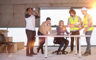 group of multiethnic business people on construction site photo