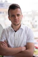 man standing at balcony photo