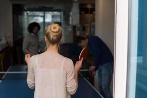 startup business team playing ping pong tennis photo