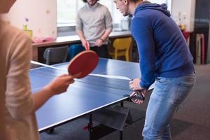 startup business team playing ping pong tennis photo