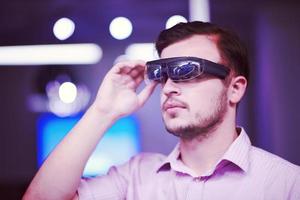 man using virtual reality gadget computer glasses photo