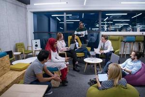 Multiethnic startup business team having meeting photo