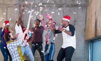 multiethnic group of casual business people having confetti party photo