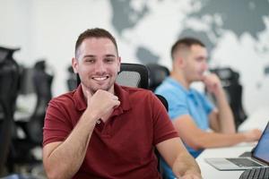 two male software developers working on computer photo