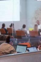 businesswoman using a laptop in startup office photo