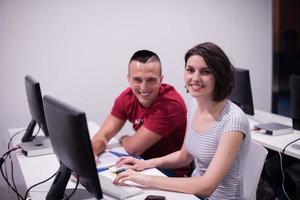 technology students group working  in computer lab school  classroom photo