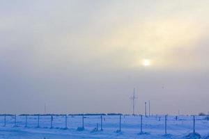 Frozen river sea on dike snow ice floes glate ice. photo