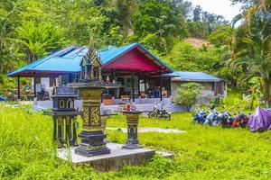 Holy ghost house shrine small temple garden yard village Thailand. photo