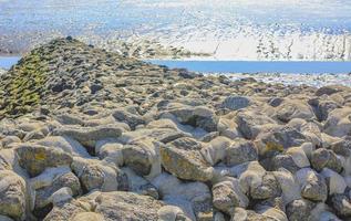 Seascape beach mudflats hiking on the North Sea coast Germany. photo