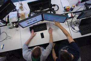 young programmers writing programming code top view photo