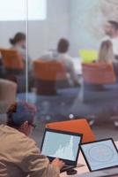 businesswoman using a laptop in startup office photo