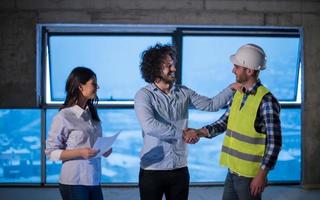 business people in group, architect and engineer on construction site photo