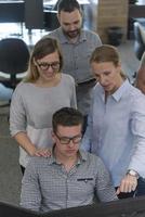 startup business people group working as team to find solution photo