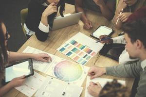 Multiethnic startup business team having meeting photo