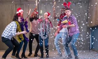 multiethnic group of casual business people having confetti party photo