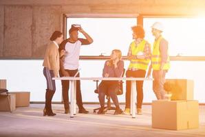 group of multiethnic business people on construction site photo
