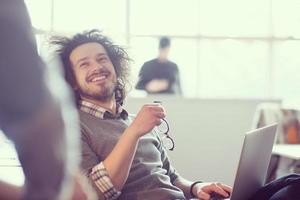businessman working using a laptop in startup office photo