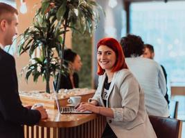 modern man and woman use modern devices, laptop, tablet and smartphone and arrange new projects for the job. Business concept . photo