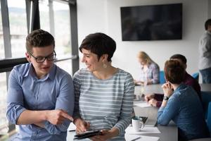 business People Working With Tablet in office photo