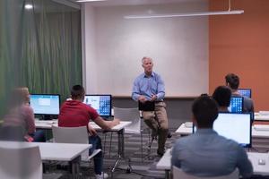 teacher and students in computer lab classroom photo