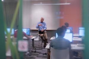 teacher and students in computer lab classroom photo