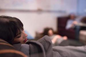 software developers sleeping on sofa in creative startup office photo