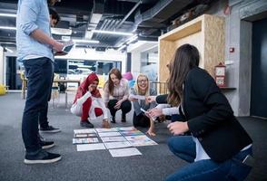 black muslim woman having meeting with Multiethnic  startup business team photo