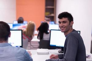 technology students group working  in computer lab school  classroom photo