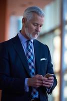 senior business man talk on mobile phone photo