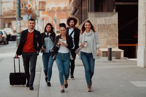 Elegant businesspeople walking in a modern city after hard workig day photo