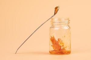 a jar and dab stick of cannabis resin for smoking with a high content of THC photo