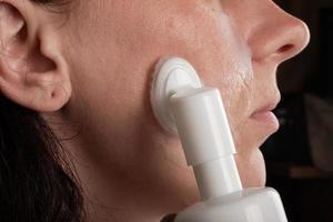 face cleaning with foam, cosmetic skin care photo