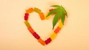 cannabis jelly candie heart and green leaf, recreational drugs photo