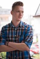 man standing at balcony photo