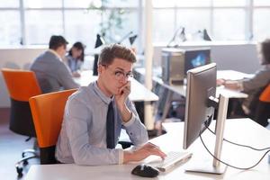 businessman working using a computer in startup office photo