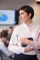 hispanic businesswoman with tablet at meeting room photo