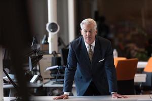 portrait of handsome senior business man at modern office photo