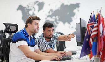 two male software developers working on computer photo