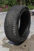 Unused used car tires with black texture, taken with creative angles photo
