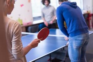 startup business team playing ping pong tennis photo