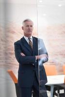 portrait of handsome senior business man at modern office photo