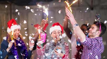 multiethnic group of casual business people taking selfie during new year party photo